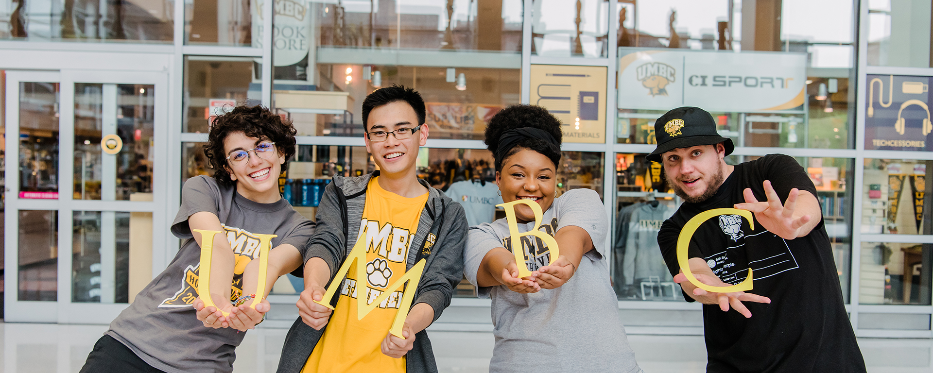 students holding letters UMBC