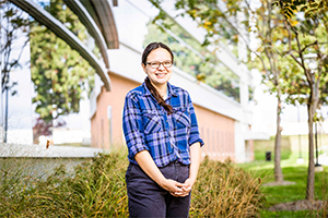 Emily Brown posed outdoors in front of a building
